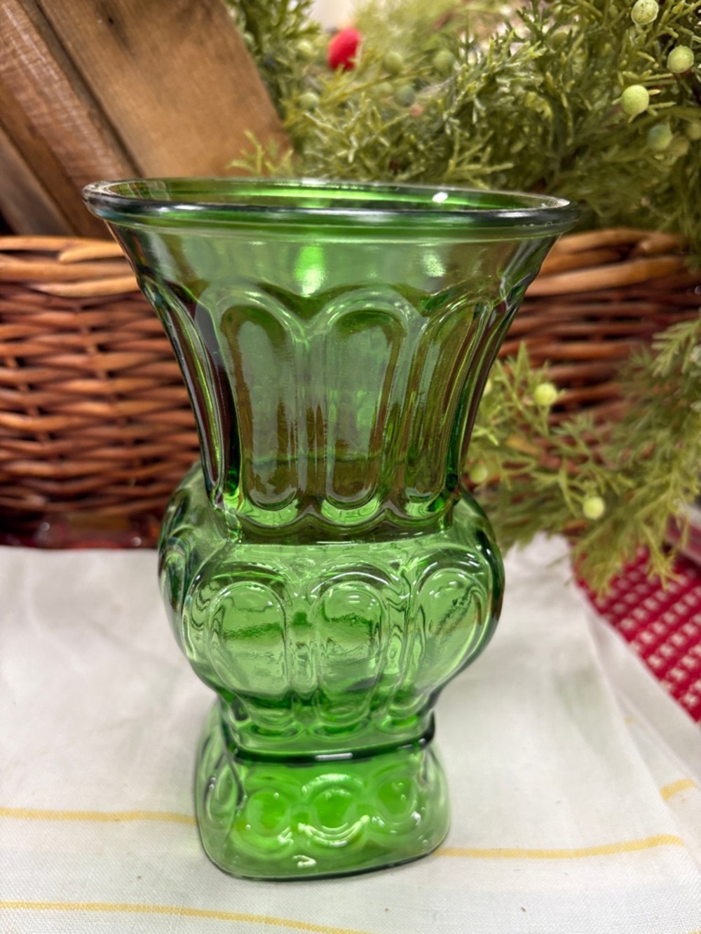 vintage A.L. Randall Co.emerald green glass vase featuring molded scroll pattern